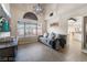 Comfortable living room featuring tile floors, a large window, and stylish decor at 4209 Glass Lantern Dr, North Las Vegas, NV 89032