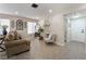 Open living room featuring tile floors, neutral walls, and a comfortable seating area with lots of light at 4209 Glass Lantern Dr, North Las Vegas, NV 89032
