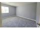 A bright, airy bedroom with new carpets and large window at 4400 Sandy River Dr # 4, Las Vegas, NV 89103