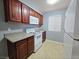 Well-lit kitchen showcasing ample cabinetry, white appliances, and practical layout at 4400 Sandy River Dr # 4, Las Vegas, NV 89103