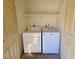 Compact laundry room with white washer and dryer, perfect for easy chores at 4400 Sandy River Dr # 4, Las Vegas, NV 89103