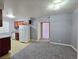 Open concept living room with dining area and access to kitchen at 4400 Sandy River Dr # 4, Las Vegas, NV 89103