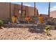 Bella Vita stone community signage is surrounded by beautiful landscaping at 4400 Sandy River Dr # 4, Las Vegas, NV 89103