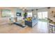 Bright living room with a modern sofa, stylish decor, and sliding glass doors to a patio at 4434 Bayley Skye Ave # 179, Las Vegas, NV 89141