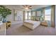 Stylish main bedroom featuring plush carpeting, natural light, and decorative artwork at 4434 Bayley Skye Ave # 179, Las Vegas, NV 89141
