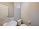 Simple powder room featuring a sink with silver faucet and a toilet at 4503 Meteora Ledge Ave, North Las Vegas, NV 89084
