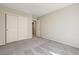 Bright bedroom with carpet and closet with door leading to the bathroom at 4503 Meteora Ledge Ave, North Las Vegas, NV 89084