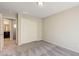 Bright bedroom featuring carpeted floors and a closet, perfect for relaxation at 4503 Meteora Ledge Ave, North Las Vegas, NV 89084