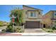 Inviting two-story home with desert landscaping, paver driveway, and a two-car garage in a modern community at 4503 Meteora Ledge Ave, North Las Vegas, NV 89084
