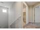 Upstairs hallway with a carpeted floor and a half-wall railing at 4503 Meteora Ledge Ave, North Las Vegas, NV 89084
