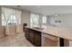 Modern kitchen featuring stainless steel appliances, granite countertops, and a central island sink at 4503 Meteora Ledge Ave, North Las Vegas, NV 89084