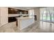 Well-equipped kitchen featuring granite countertops, stainless steel appliances, and a kitchen island at 4503 Meteora Ledge Ave, North Las Vegas, NV 89084
