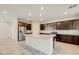 Bright kitchen featuring stainless steel appliances, granite countertops, and ample cabinet space at 4503 Meteora Ledge Ave, North Las Vegas, NV 89084