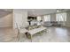 Bright open-concept living and dining area with tile flooring, and abundant natural light from sheer-curtained windows at 4503 Meteora Ledge Ave, North Las Vegas, NV 89084