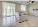Bright living area with tile flooring, ceiling fan, and access to the backyard through glass sliding doors at 4503 Meteora Ledge Ave, North Las Vegas, NV 89084