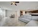 Bright living area leading to a modern kitchen with stainless steel appliances and a spacious dining area at 4503 Meteora Ledge Ave, North Las Vegas, NV 89084