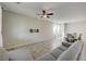 Open-concept living area featuring tile floors, a ceiling fan, and a pre-installed TV mount on the wall at 4503 Meteora Ledge Ave, North Las Vegas, NV 89084