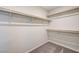 Spacious walk-in closet featuring carpeted floor and built-in shelving at 4503 Meteora Ledge Ave, North Las Vegas, NV 89084