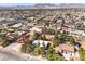 The aerial view shows the property amongst desert landscaping with close proximity to shopping and highway access at 5715 Gilbert Ln, Las Vegas, NV 89130