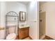 Bathroom featuring a single sink vanity, stand-up shower, and metal shelving at 5715 Gilbert Ln, Las Vegas, NV 89130