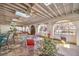 Bright sunroom with brick floors, skylights, ceiling fans, arched windows and space for seating and plants at 5715 Gilbert Ln, Las Vegas, NV 89130