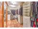 Spacious walk-in closet with custom shelving, drawers, and ample storage space for clothes and accessories at 5715 Gilbert Ln, Las Vegas, NV 89130