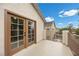 Private outdoor balcony, accessible through glass doors, offers serene views of the neighborhood at 575 Dusty Palms Ln, Henderson, NV 89052