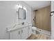 Modern bathroom featuring a stylish vanity, updated fixtures, and a walk-in shower with decorative tiling at 575 Dusty Palms Ln, Henderson, NV 89052