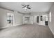 Large carpeted bedroom boasting an ensuite bathroom and a bar area for entertaining at 575 Dusty Palms Ln, Henderson, NV 89052
