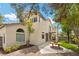 Home exterior showcasing a well maintained yard and a covered patio at 575 Dusty Palms Ln, Henderson, NV 89052
