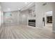 Bright open concept living room featuring high ceilings and wood flooring at 575 Dusty Palms Ln, Henderson, NV 89052