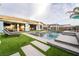 Well landscaped backyard featuring a pool, covered patios, lounge furniture, and mature landscaping at 5865 Alice Landing Ct, Las Vegas, NV 89149