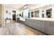 Bright bathroom with dual vanities, gray cabinets, marble countertop, and walk-in closet at 5865 Alice Landing Ct, Las Vegas, NV 89149