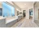 Bright bathroom with dual vanities, marble countertop, and walk-in closet at 5865 Alice Landing Ct, Las Vegas, NV 89149
