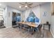 Elegant dining area featuring an eight-seat table, stylish decor, and sliding glass door access at 5865 Alice Landing Ct, Las Vegas, NV 89149
