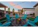 Gather around the cozy fire pit in this backyard, perfect for entertaining or enjoying quiet evenings at 5865 Alice Landing Ct, Las Vegas, NV 89149