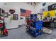 Well-equipped garage space featuring tool storage, work area, and American flag at 5865 Alice Landing Ct, Las Vegas, NV 89149