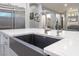 Kitchen island with a sink, granite counters, and stainless steel appliances at 5865 Alice Landing Ct, Las Vegas, NV 89149