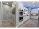 Modern kitchen featuring stainless steel appliances, sleek white cabinets, and hardwood floors at 5865 Alice Landing Ct, Las Vegas, NV 89149