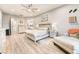 Spacious main bedroom with hardwood floors, king bed, and decor, and an ensuite bathroom at 5865 Alice Landing Ct, Las Vegas, NV 89149