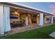 Spacious outdoor patio perfect for entertaining, complete with fans, TV, dining and seating areas at 5865 Alice Landing Ct, Las Vegas, NV 89149