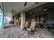 Relaxing covered patio with comfortable seating, ceiling fans, and an inviting outdoor ambiance at 5865 Alice Landing Ct, Las Vegas, NV 89149