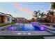 Enjoy outdoor living with a gorgeous pool, waterfall features, mature palm trees and plenty of space at 5865 Alice Landing Ct, Las Vegas, NV 89149
