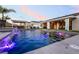 Relax in this refreshing pool with captivating waterfall features and mesmerizing lights for ultimate enjoyment at 5865 Alice Landing Ct, Las Vegas, NV 89149