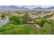 Community park with picnic area nestled among lush trees and green space in a well-maintained neighborhood at 617 Apricot Rose Pl, Las Vegas, NV 89138