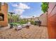 Charming back patio with beautiful pavers, stylish outdoor seating, a grill, and a cozy fire pit, perfect for entertaining at 617 Apricot Rose Pl, Las Vegas, NV 89138