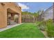 Well-maintained backyard featuring artificial turf, ideal for low-maintenance outdoor enjoyment at 617 Apricot Rose Pl, Las Vegas, NV 89138
