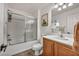 Functional bathroom features a shower-tub combo, single sink vanity, and neutral finishes at 617 Apricot Rose Pl, Las Vegas, NV 89138