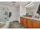 Bright bathroom features a double vanity, soaking tub and glass enclosed shower at 617 Apricot Rose Pl, Las Vegas, NV 89138