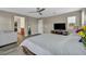 Bright bedroom with a ceiling fan offers ample space, an entertainment center, and closet access at 617 Apricot Rose Pl, Las Vegas, NV 89138